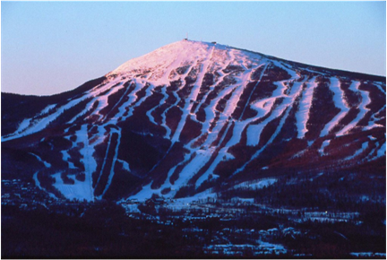 sunset over a snowy mountain