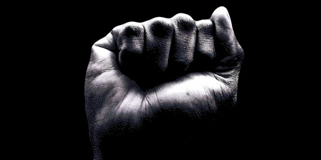 Black and white picture of a fist in the air